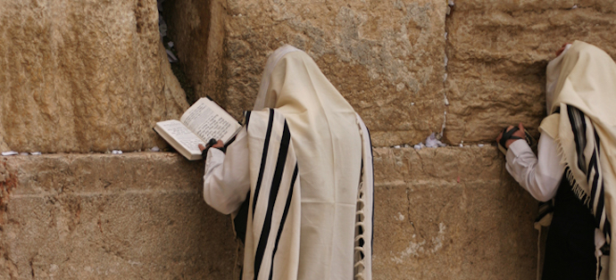 Man-praying-at-the-Western-wall-in-a-traditional-Tallit-or-Prayer-Shawl-_-by-Beggs_crop